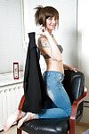Barefoot mature brunette in jeans baring small tits while undressing