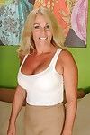 Mature blonde Crystal Taylor slowly takes off her tight skirt
