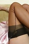 Sexy mature Satin Jayde shows off hot ass wearing lace panties and stockings