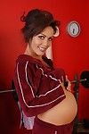 Older pregnant woman Nancy exposing belly bump and masturbating spread cunt
