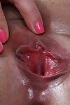 Mature lady Penny Prite revealing small tits before spreading smooth vagina
