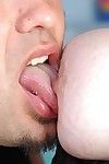 Older redheaded fatty Adrienne taking blast of jism on pierced tongue