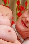 Busty aged blonde Monik folding back labia lips of pink vagina in heels