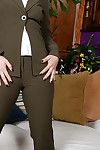 Older brunette Lisa Smith exposing clit underneath business suit in office