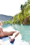 Mature brunette pornstar Veronica Avluv lets large boobs loose from bikini