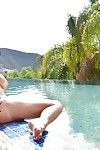 Mature brunette pornstar Veronica Avluv lets large boobs loose from bikini