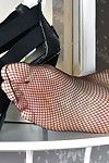 Older Euro lady Corazon Del Angel freeing sexy feet from mesh nylons