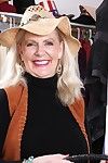 Chubby aged blonde Judy Belkins unveiling big mature tits in straw hat
