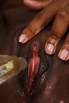 Older black woman Chiya masturbating bald twat with vibrator