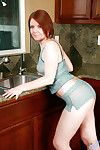 Mature redhead lady Ariana wetting pink pussy in kitchen sink