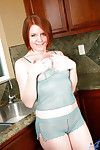 Mature redhead lady Ariana wetting pink pussy in kitchen sink