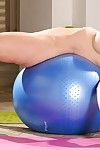 Superb vixen Sasha Sean undresses and jumps on big blue ball