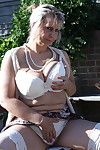 Horny mature lady strips in her garden