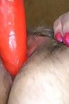 Fat and hairy old granny masturbating with a big dildo