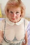 Kinky british mature lady plays with her pierced pussy