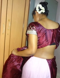 Clothed Indian woman strips to their way disgraceful bra with an increment of underskirt